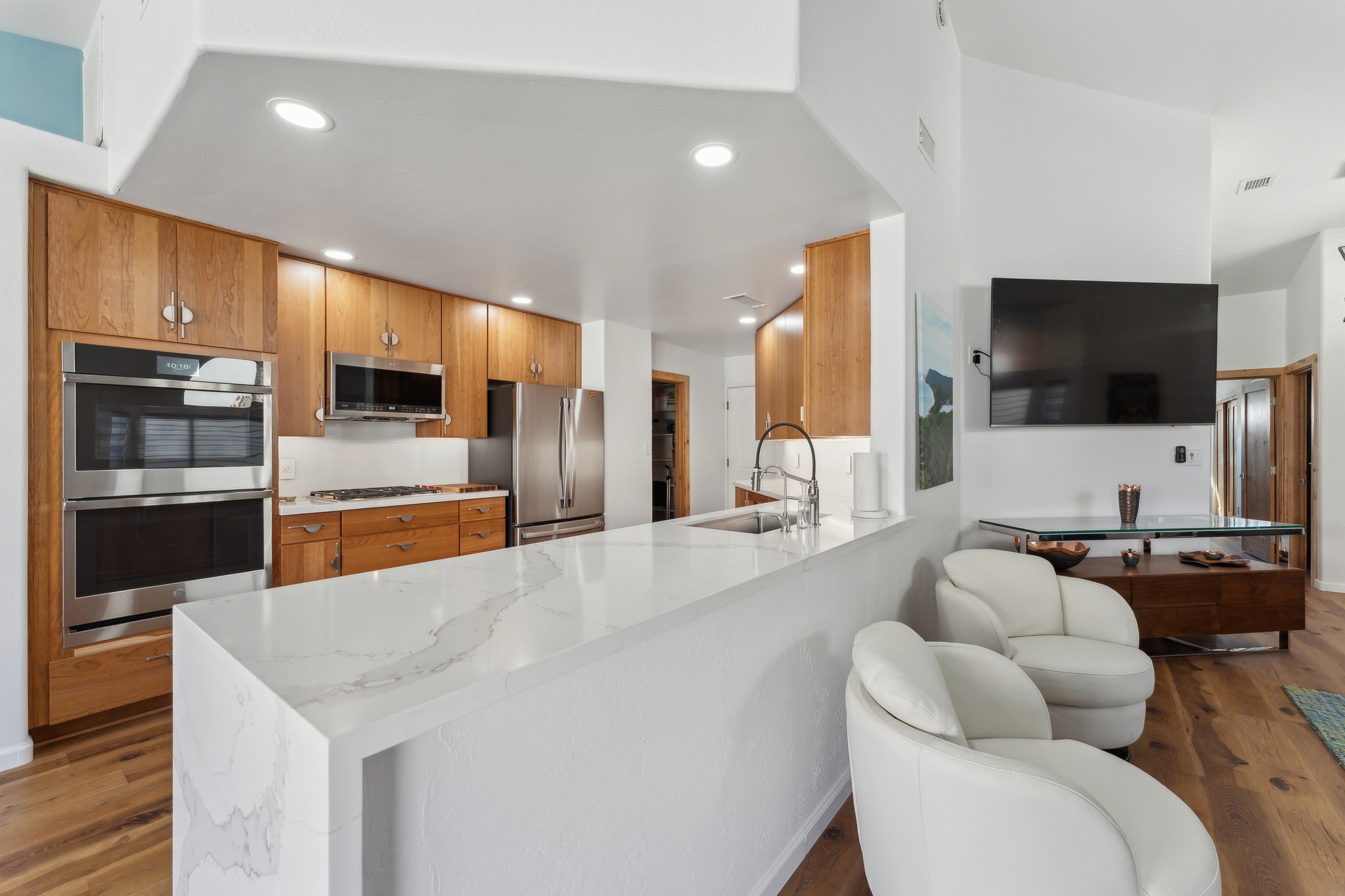 Modern kitchen design with white marble countertops