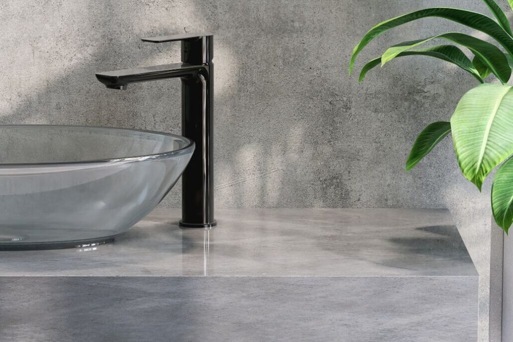 close up of glass sink on stone countertop