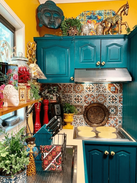 Small maximalist kitchen with contrasting colors, patterned backsplash tile, and more.