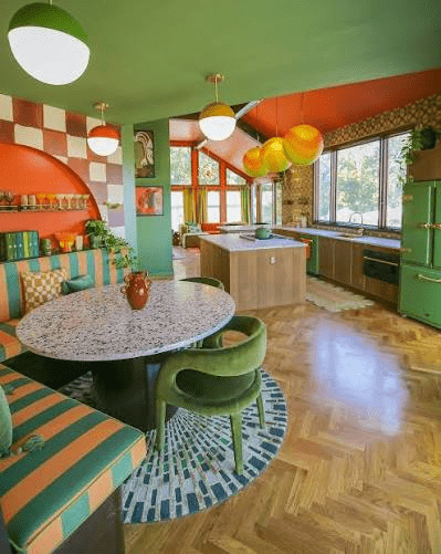 Colorful modern maximalist kitchen with spherical lights.